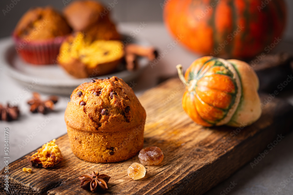 Homemade autumn pumpkin muffins with cinnamon and chocolate