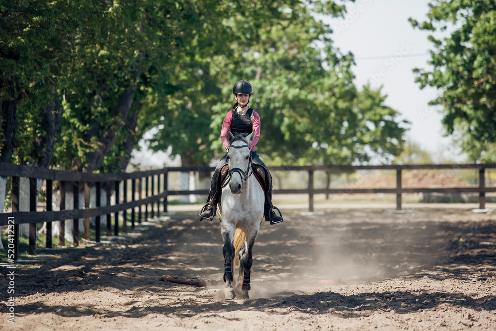 Teenage Girl in helmet Learning Horseback Riding. Teenage Girl in helmet Learning Horseback Riding.