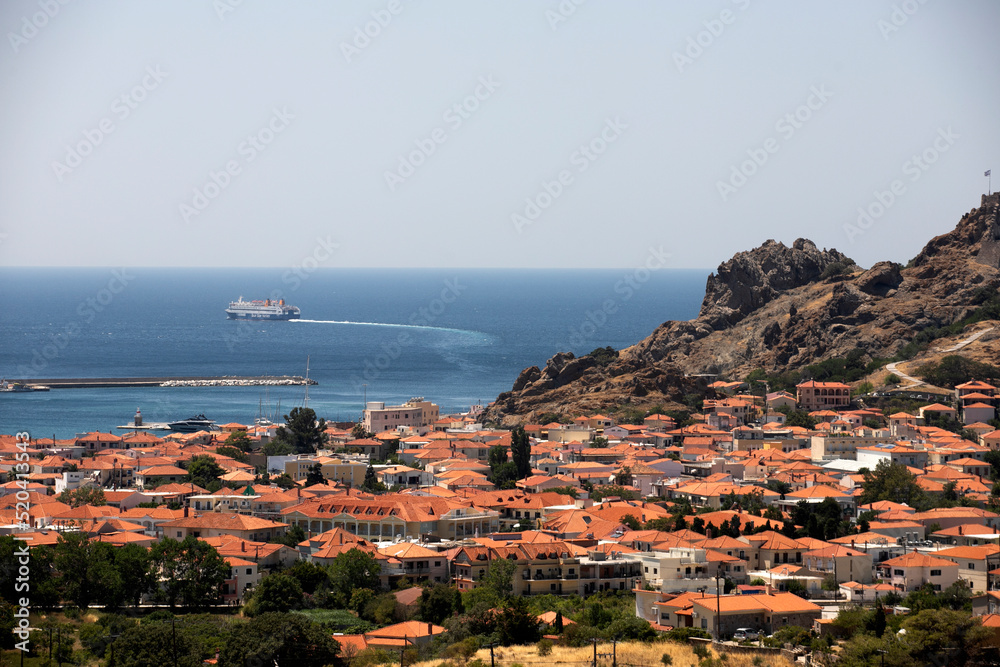 A boat leaves the port of Myrina, in Lemnos, Greece, on July 30, 2022