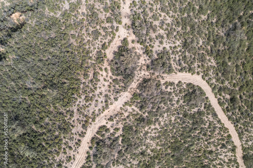 aerial photo of a plowed road in the mountains