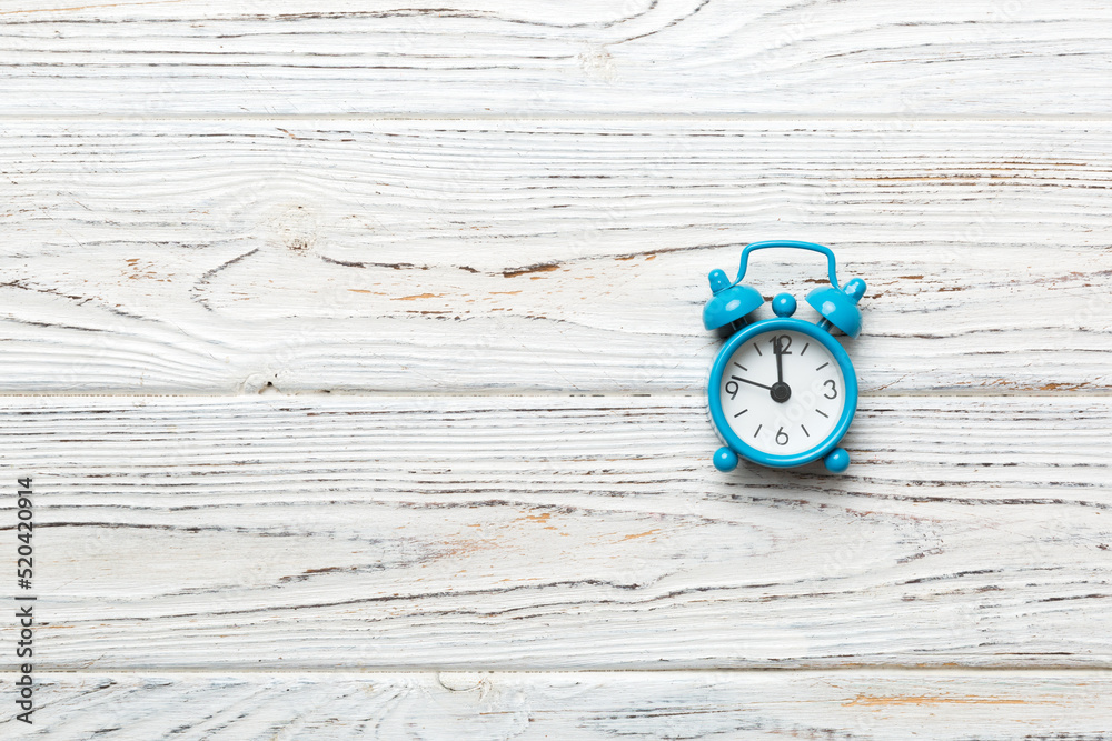 Alarm clock isolated on colored background with copy space top view Alarm clock isolated on colored background with copy space top view