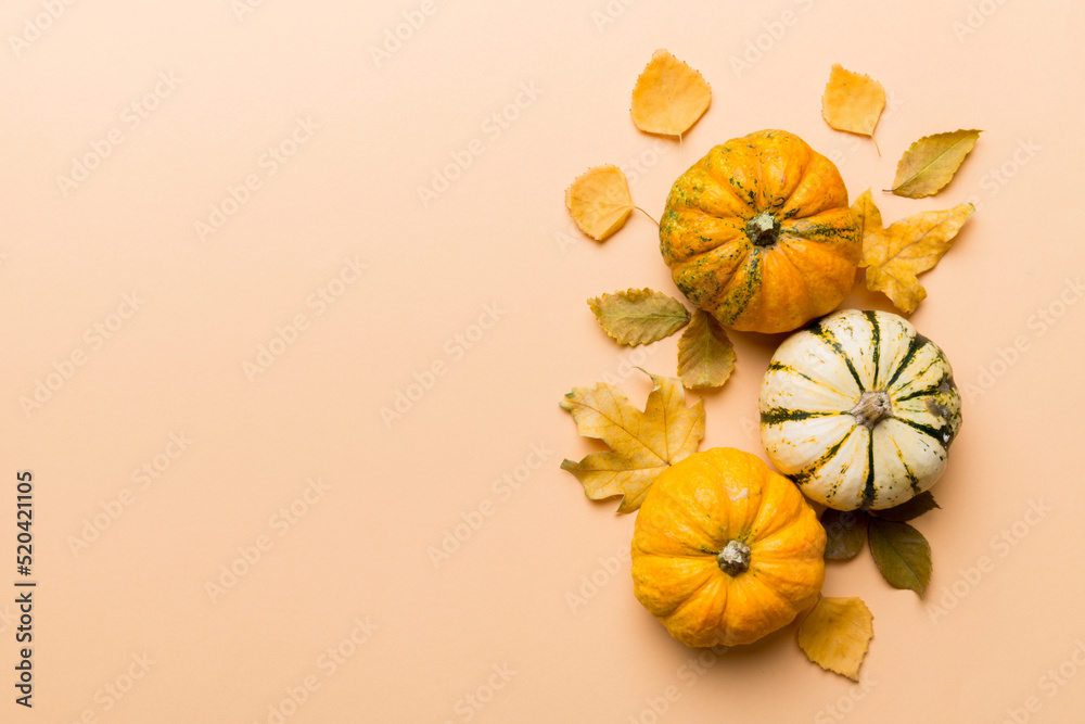 Autumn composition. Pattern made of dried leaves and other design accessories on table. Flat lay, top view Autumn composition. Pattern made of dried leaves and other design accessories on table. Flat lay, top view