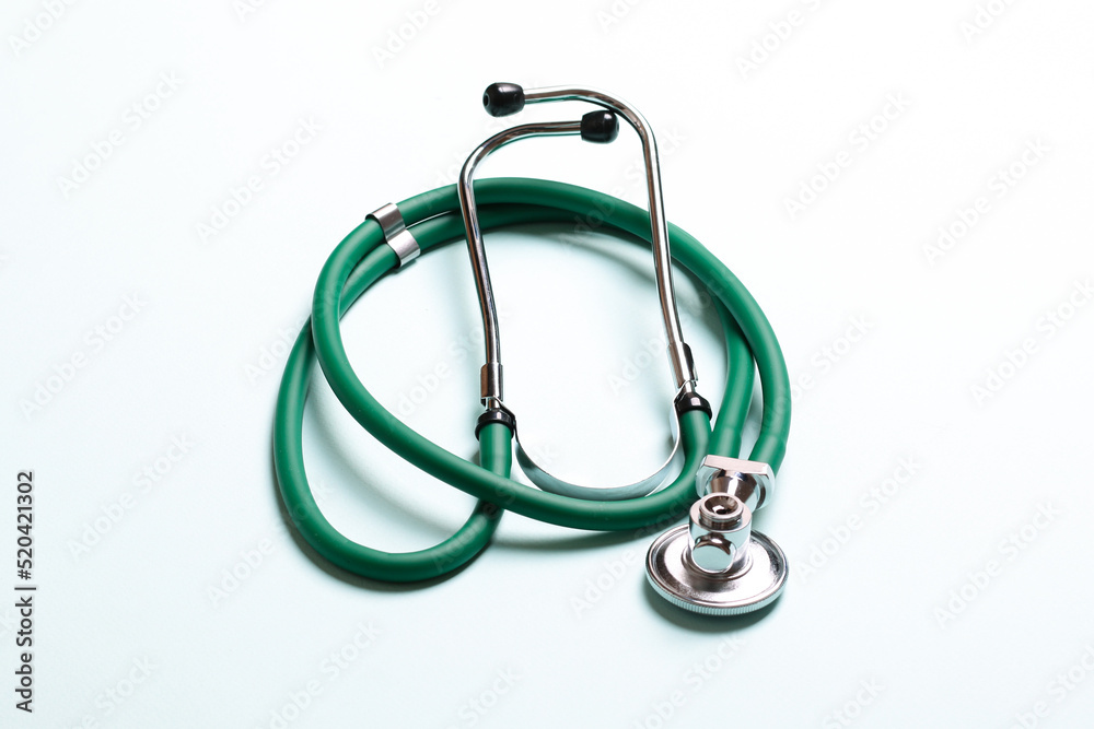 Top view of green medical stethoscope on colorful background with copy space. Medicine equipment concept Top view of green medical stethoscope on colorful background with copy space. Medicine equipment concept