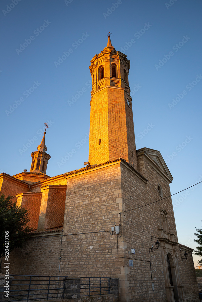 Parish Church of Our Lady of the Assumption at sunset in Fuendetodos, Campo de Belchite, province of Zaragoza, Aragon, Spain Parish Church of Our Lady of the Assumption at sunset in Fuendetodos, Campo de Belchite, province of Zaragoza, Aragon, Spain