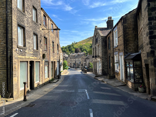 Looking down the, High Street, with old shops and cottages, in the picturesque village of, Delph, Oldham, UK