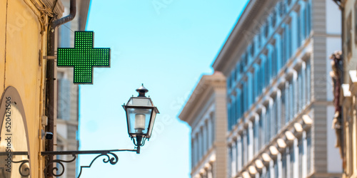 A pharmacy sign in an Italian city