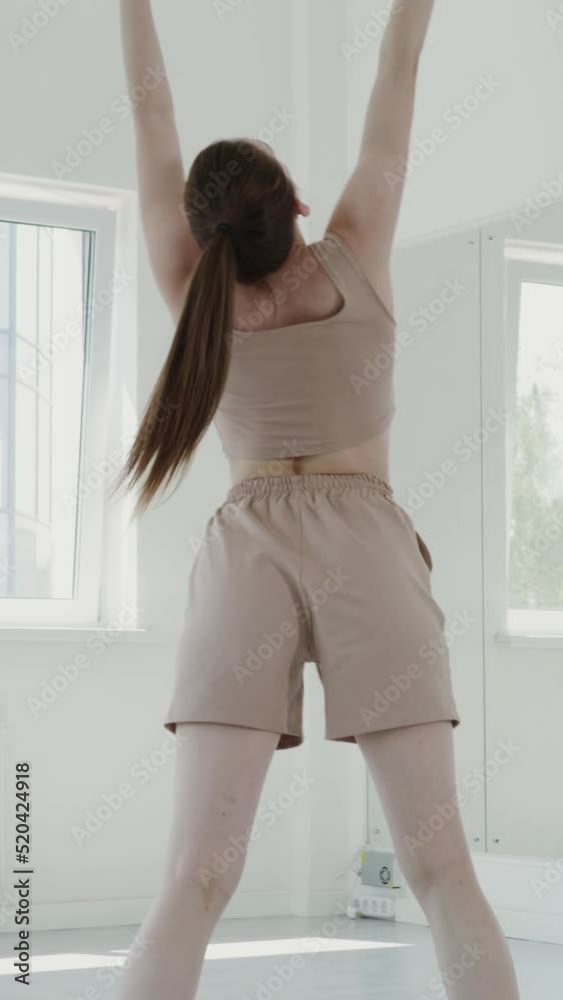 European girl in sportswear doing rhythmic ballet lunges European girl in sportswear doing rhythmic ballet lunges