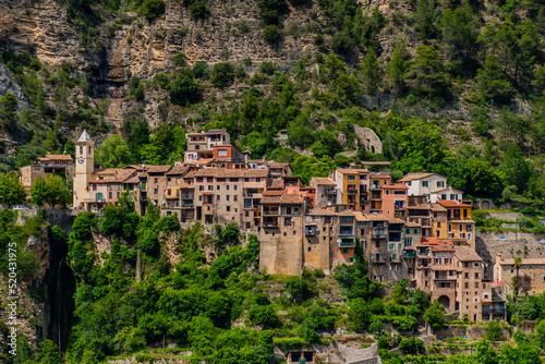 A picturesque landscape view of a medieval mountain village, Touët-sur-Var, in the Alps mountains in summer (Alpes-Maritimes, France)
