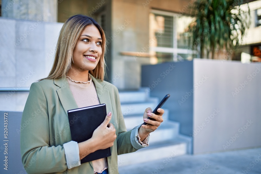 Young latin woman smiling confident using smartphone at street Young latin woman smiling confident using smartphone at street
