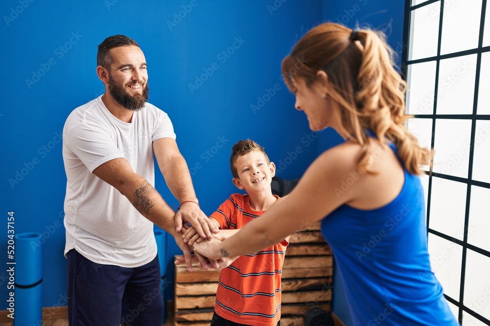 Obraz premium Family smiling confident with hands together at sport center