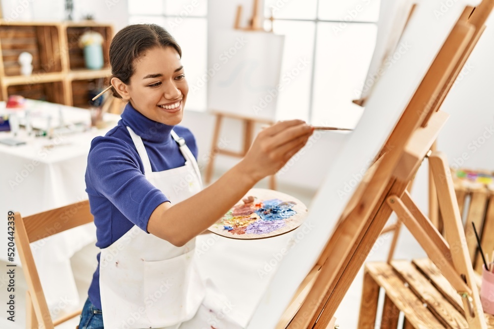 Young latin woman smiling confident drawing at art studio Young latin woman smiling confident drawing at art studio