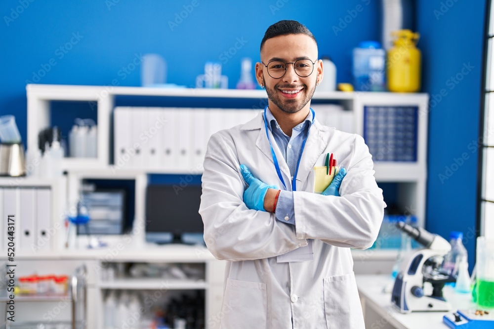 African american man scientist smiling confident standing with arms crossed gesture at laboratory African american man scientist smiling confident standing with arms crossed gesture at laboratory