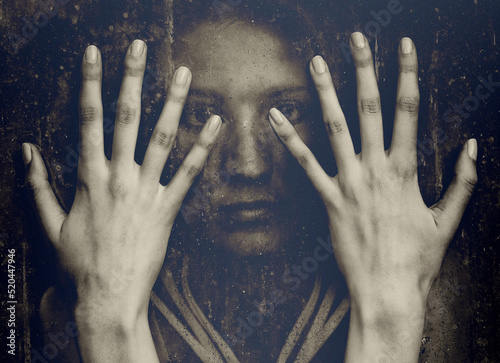 Portrait of young woman and her hands in sepia tones
