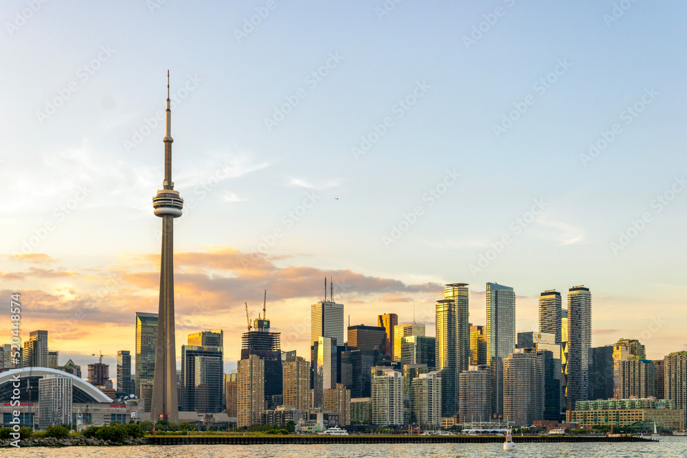 Fototapeta premium Downtown Toronto skyline with CN Tower and skyscrapers at sunset