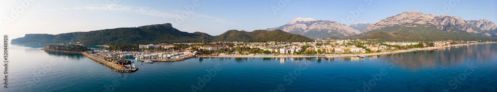 Panoramic photo of Kemer, resort town on Mediterranean coast of Turkey. City on Turkish Riviera from above.