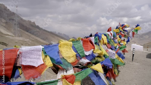 Fluttering Prayer Flags On A Windy Day In Thikse Monastery, Ladakh, India. - close up photo