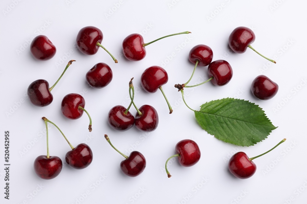 Many sweet ripe cherries on white background, flat lay Many sweet ripe cherries on white background, flat lay