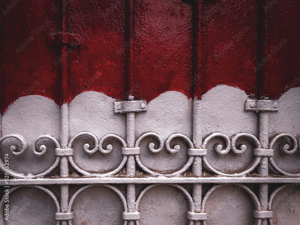 red paint on white patterned wall