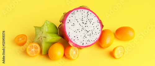 Fototapeta Naklejka Na Ścianę i Meble -  Tasty exotic fruits on yellow background