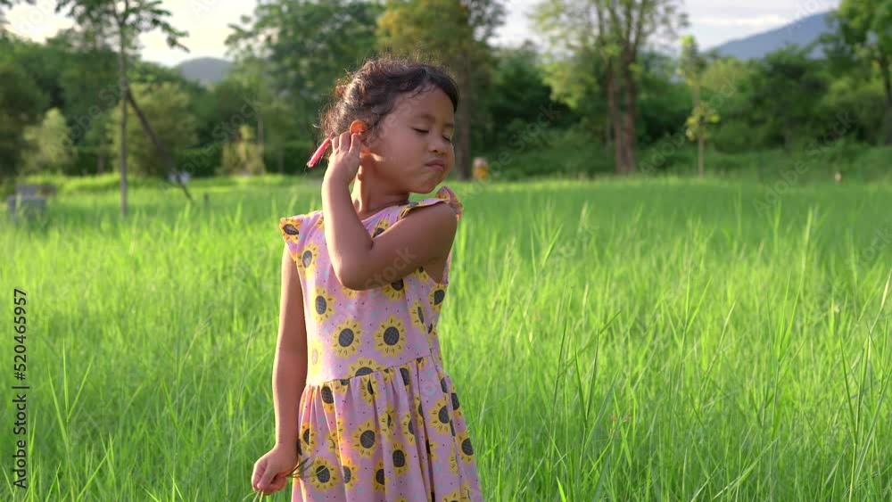 Funny face expression standing at grass field against mountain. Funny face expression standing at grass field against mountain.