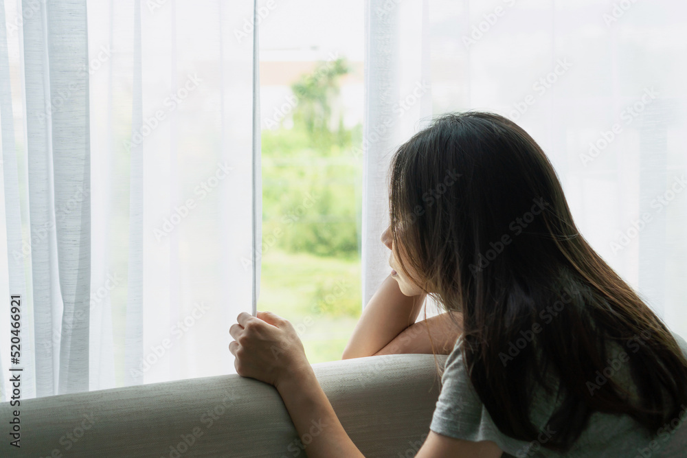Teenager girl with depression sitting alone on sofa at home. Sad, unhappy, disappointed concept. Close up Teenager girl with depression sitting alone on sofa at home. Sad, unhappy, disappointed concept. Close up