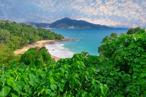 Colourful Skies Sunset over Head Laem Sing Beach in Phuket Thailand. This Lovely island waters are turquoise blue waters, lush green mountains colourful skies and beautiful views of Pa Tong Patong