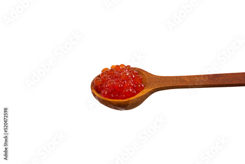 Red caviar in the wooden spoon isolated on white background.