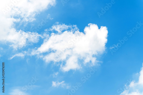 White fluffy clouds in blue sky.