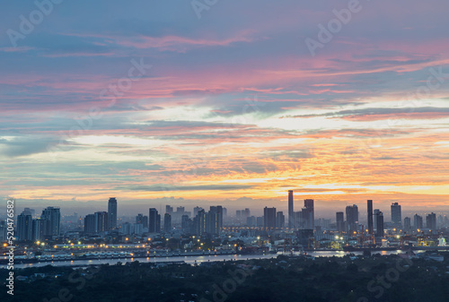 Bangkok,Thailnad - Jul 23, 2022 : Gorgeous scenic of the sunrise or sunset with beautiful cloud and sky over large metropolitan city in Bangkok. Copy space, Selective focus.