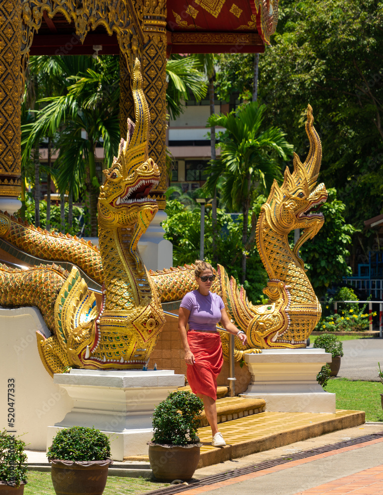 Fototapeta premium Traveler woman visiting a buddhist temple in Bangkok