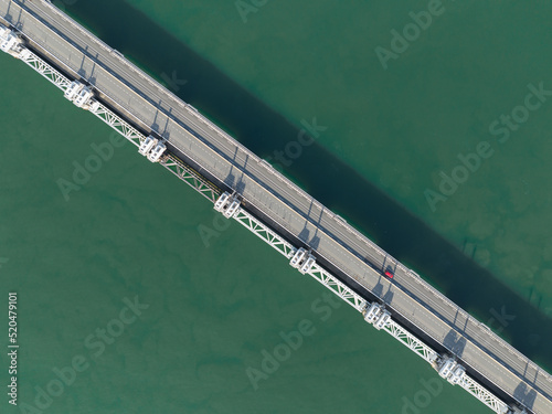 Overhead top down view of Oosterschelde barrier closable storm surge barrier and road. The Delta Works water flood defense system, in the Netherlands, protection from the sea in Zeeland.