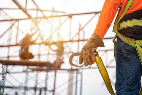 Foto Close up hand of Worker in construction site Working at height equipment
