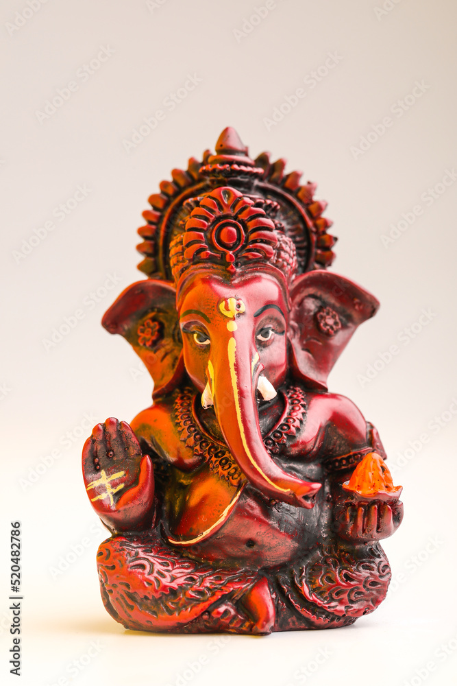 Fototapeta premium Lord ganesha sculpture on white background.