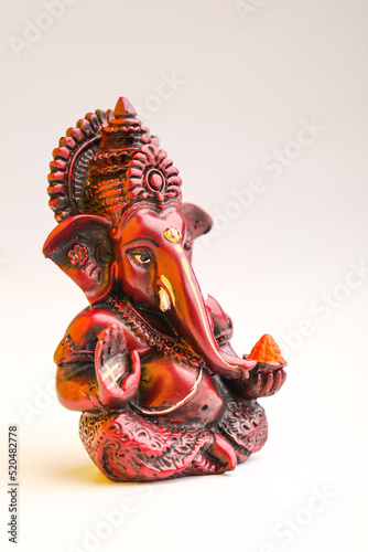 Lord ganesha sculpture on white background.