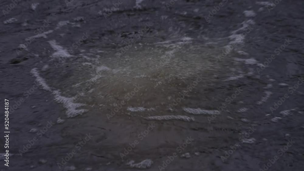 Close-up shot of boiling water in an ice hole in southern Estonia Close-up shot of boiling water in an ice hole in southern Estonia