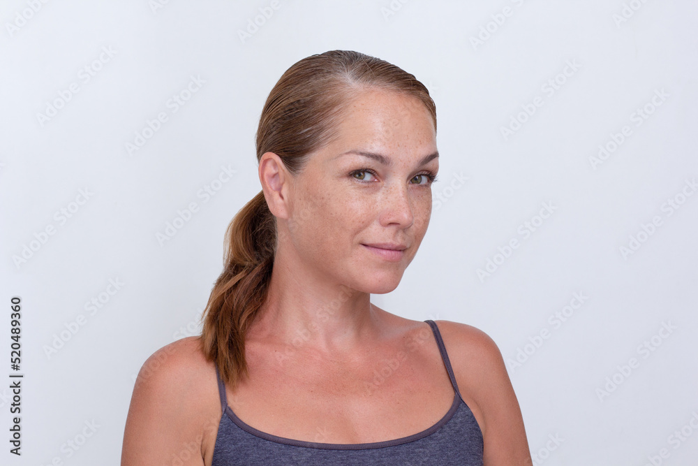 Portrait of caucasian beautiful middle aged woman of 40s looking at camera on white background Portrait of caucasian beautiful middle aged woman of 40s looking at camera on white background
