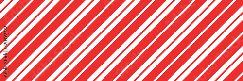 Christmas candy cane striped seamless pattern. Christmas candycane background with red stripes. Caramel diagonal print. Xmas traditional wrapping texture. Vector illustration.