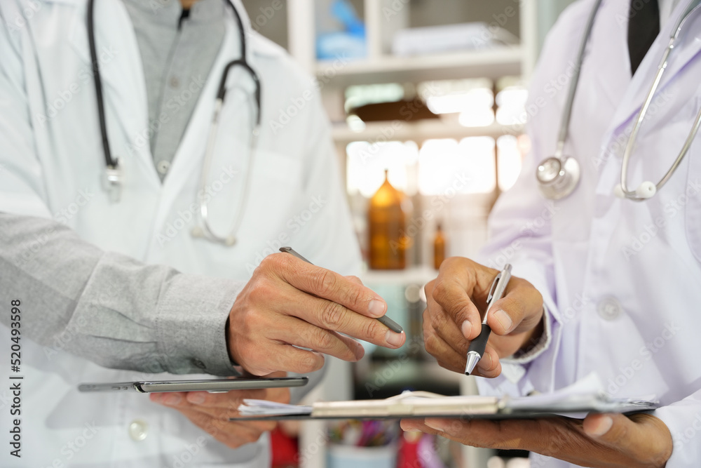 The doctor checks the patient's history in the hospital