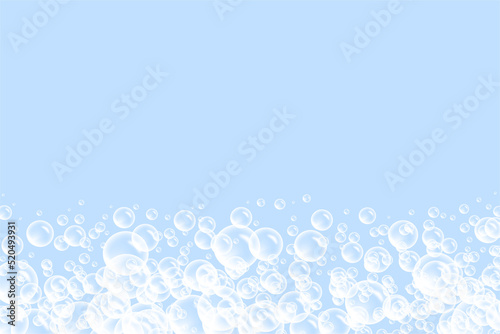 Bubbles border background, bath soap suds with bunch of foam spheres in many circular sizes floating as clean blue symbols of washing and bath freshness.