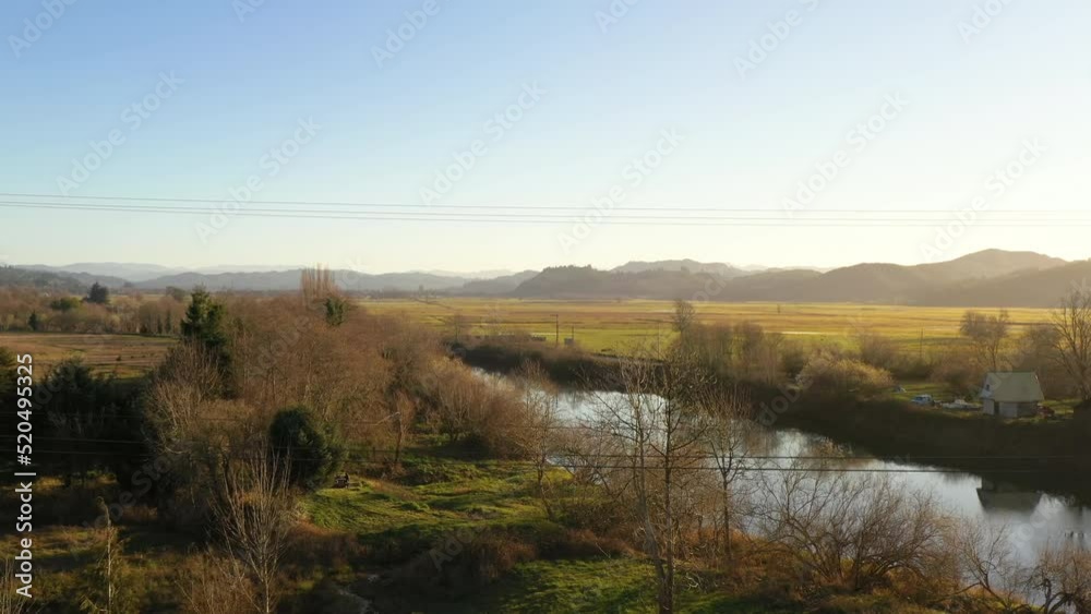 Scenic aerial view of Coquille River and agricultural fields and farms. Fertile Coquille Valley. Scenic aerial view of Coquille River and agricultural fields and farms. Fertile Coquille Valley.