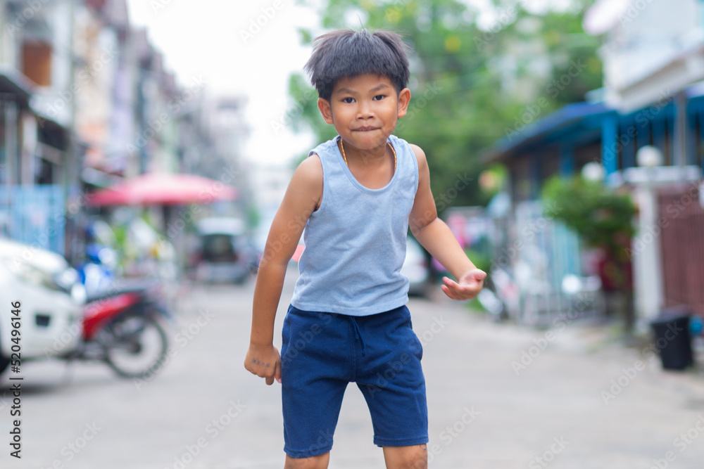 Asian boy Show fun faces and gestures that has been played by jumping Asian boy Show fun faces and gestures that has been played by jumping