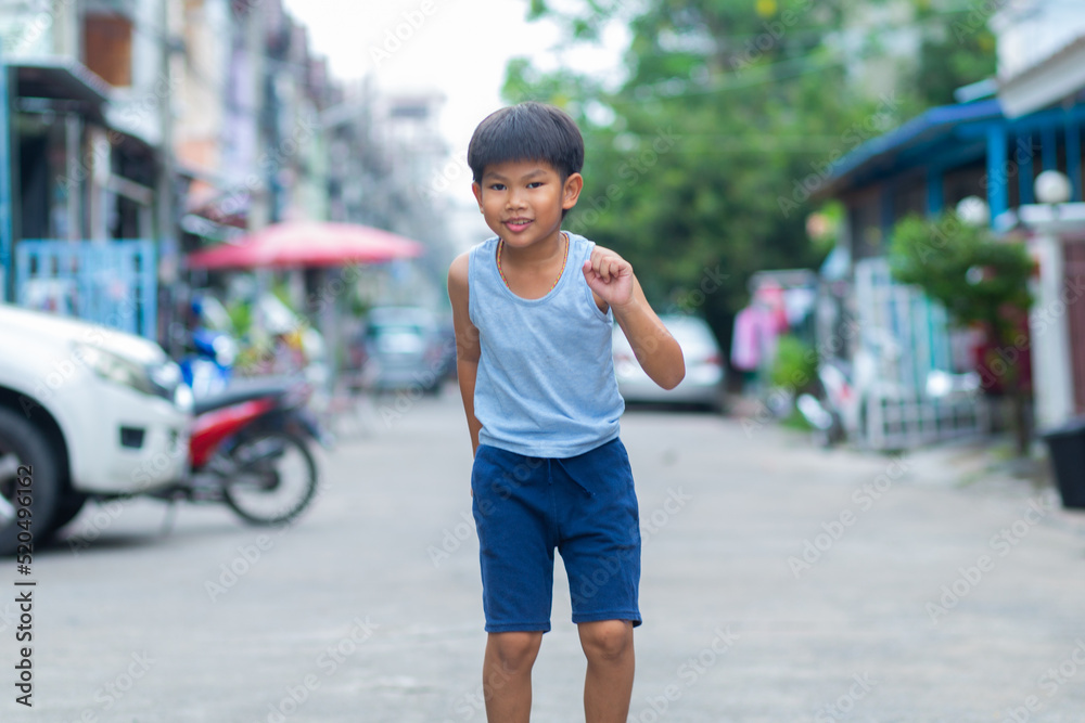 Asian boy Show fun faces and gestures that has been played by jumping Asian boy Show fun faces and gestures that has been played by jumping