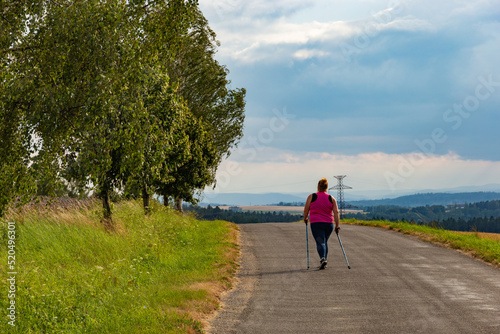 Nordic walking - active woman outdoors
