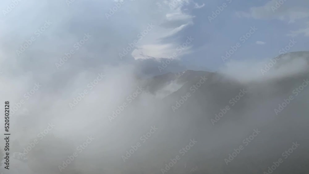 Cloud evolution passing into a mountain valley Cloud evolution passing into a mountain valley