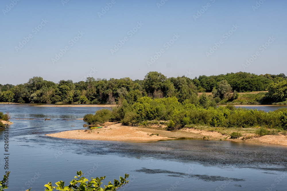 Obraz premium People relaxing on a sandbank in the Loire river in France