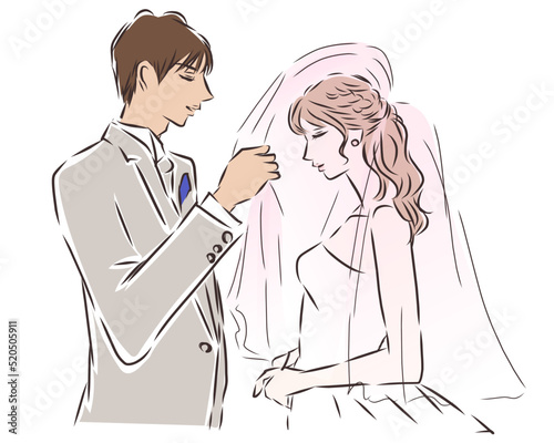 結婚式　新婦のウェディングベールを上げる新郎
