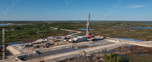 oil and gas drilling platform in the summer tundra