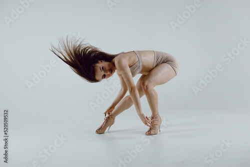 Fototapeta Young woman dancer dancing high heels dance