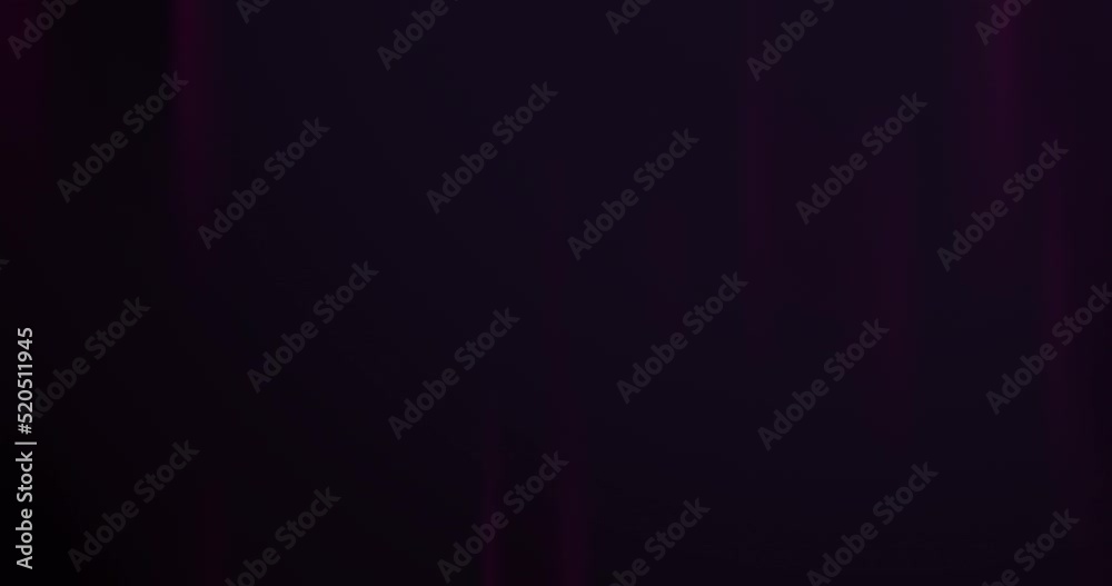 Dark black background with light shades and rays of light. Loop background with black, purple tones and vivid light trails. Abstract background with motion use as a concept for text and presentation