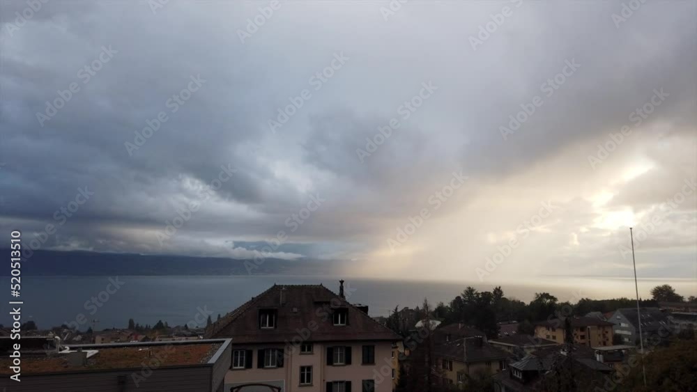 Timelapse of the geneva lake with changing weather: a few sun rays and at the end, a cloudy sky Timelapse of the geneva lake with changing weather: a few sun rays and at the end, a cloudy sky